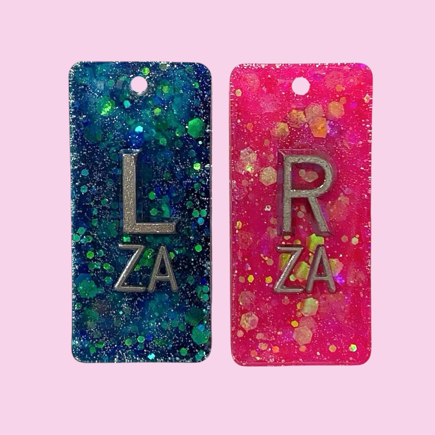 Blue and pink glitter X-Ray markers with initials